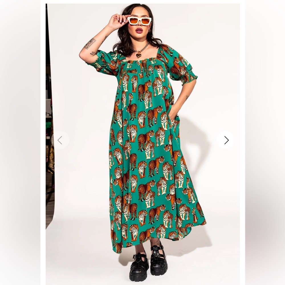 Dressed in Lala smocked dress in tiger tales